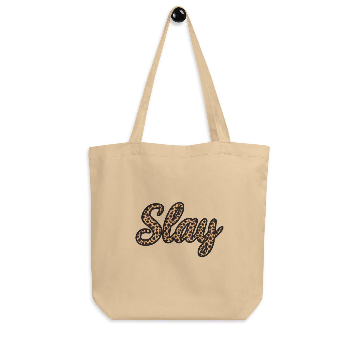 Natural colored Slay dual handle canvas tote bag featuring leopard-print script